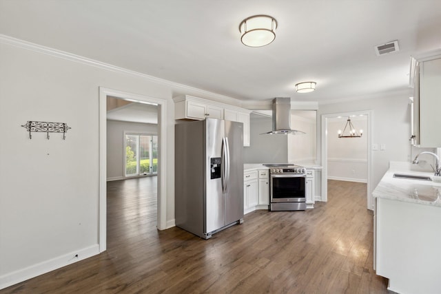 8394 N Westfair Cir N, Germantown, TN 38139 - kitchen with stainless steel appliances, wall chimney range hood, white cabinetry, dark wood-style flooring, and ornamental molding