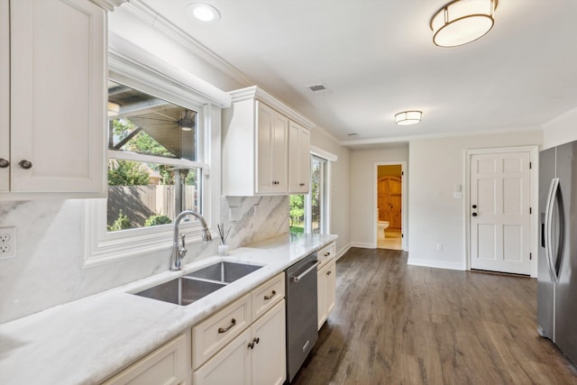 8394 N Westfair Cir N, Germantown, TN 38139 - kitchen featuring appliances with stainless steel finishes, plenty of natural light, tasteful backsplash, white cabinets, and crown molding