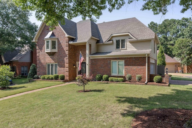 8394 N Westfair Cir N, Germantown, TN 38139 - view of front of property featuring brick siding, a front yard, roof with shingles, and a garage