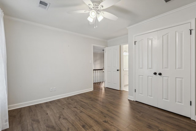 8394 N Westfair Cir N, Germantown, TN 38139 - unfurnished bedroom with dark wood-style floors, crown molding, a closet, a ceiling fan, and connected bathroom