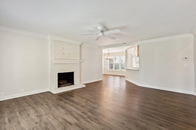 8394 N Westfair Cir N, Germantown, TN 38139 - unfurnished living room with a chandelier, crown molding, a ceiling fan, dark wood finished floors, and a fireplace