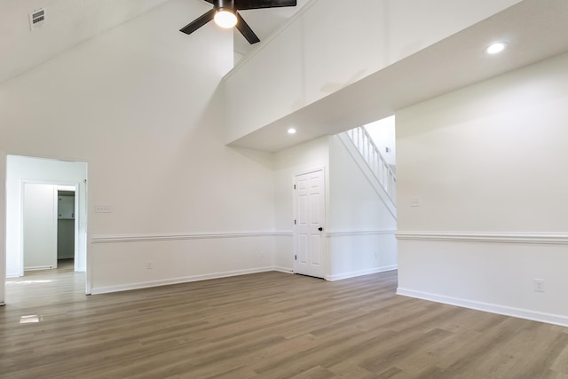 8729 Dexter Rd, Memphis, TN 38016 - additional living space featuring a towering ceiling, a ceiling fan, wood finished floors, stairs, and recessed lighting