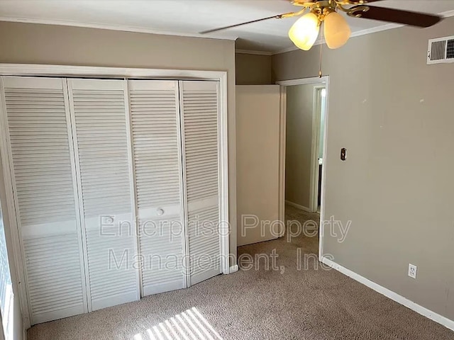 1750 Sea Isle Rd, Memphis, TN 38117 - unfurnished bedroom with a closet, crown molding, carpet, and a ceiling fan