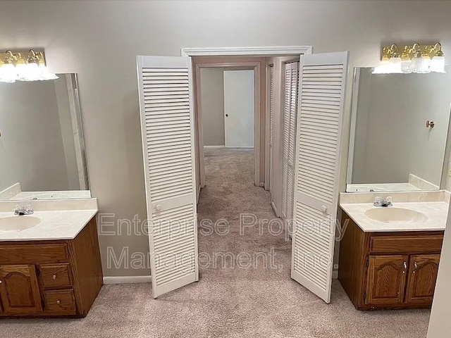 1750 Sea Isle Rd, Memphis, TN 38117 - full bathroom featuring carpet flooring, two vanities, and a closet