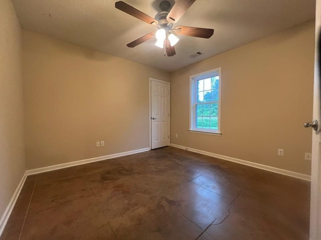 199 Bucksnort Rd, Covington, TN 38019 - spare room with baseboards and a ceiling fan