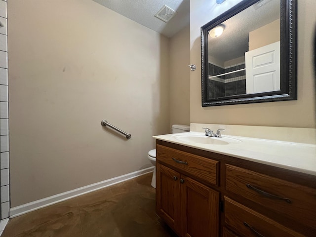 199 Bucksnort Rd, Covington, TN 38019 - full bathroom featuring vanity, a tile shower, a textured ceiling, and tile patterned floors