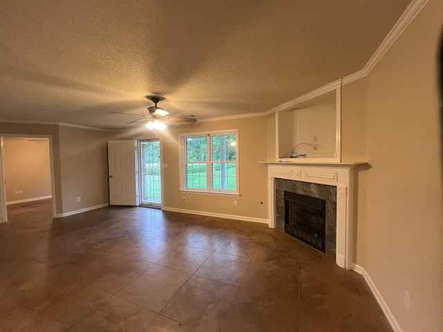 199 Bucksnort Rd, Covington, TN 38019 - unfurnished living room featuring ornamental molding, a ceiling fan, a tile fireplace, dark tile patterned floors, and a textured ceiling
