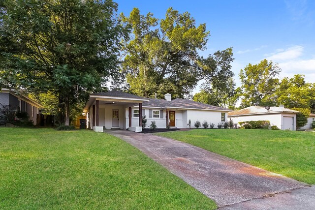 4143 Hilldale Ave, Memphis, TN 38117 - single story home featuring a front lawn, asphalt driveway, a chimney, and an attached carport