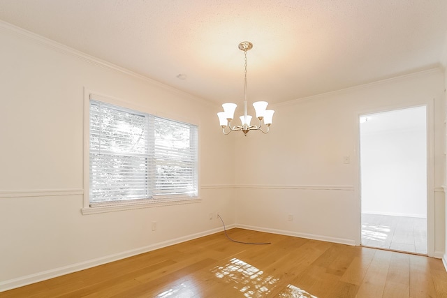 4143 Hilldale Ave, Memphis, TN 38117 - unfurnished room featuring light wood-style floors, crown molding, and a chandelier