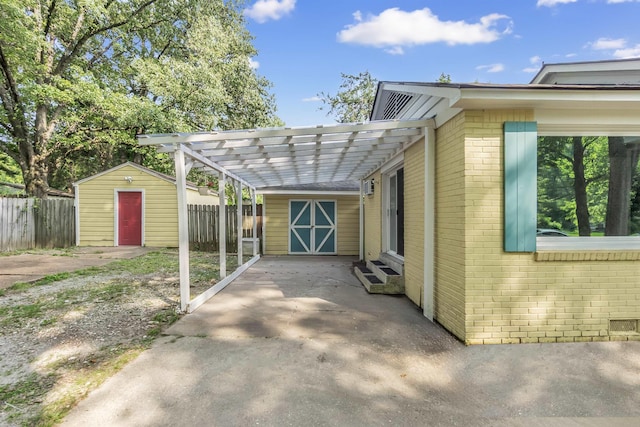 3024 Keats Rd, Bartlett, TN 38134 - view of property exterior featuring a shed, a carport, brick siding, and driveway
