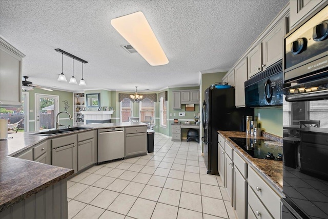 6806 Briarfield Ln, Bartlett, TN 38135 - kitchen with black appliances, gray cabinetry, dark countertops, a chandelier, and a textured ceiling