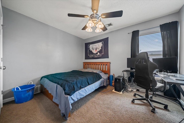 6806 Briarfield Ln, Bartlett, TN 38135 - carpeted bedroom with an office area, a textured ceiling, and a ceiling fan