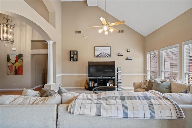 6806 Briarfield Ln, Bartlett, TN 38135 - living area with ornate columns, arched walkways, high vaulted ceiling, and a ceiling fan
