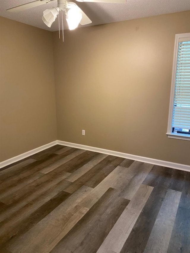 4769 Shadow View Ln, Bartlett, TN 38002 - empty room featuring ceiling fan, dark wood finished floors, and a textured ceiling