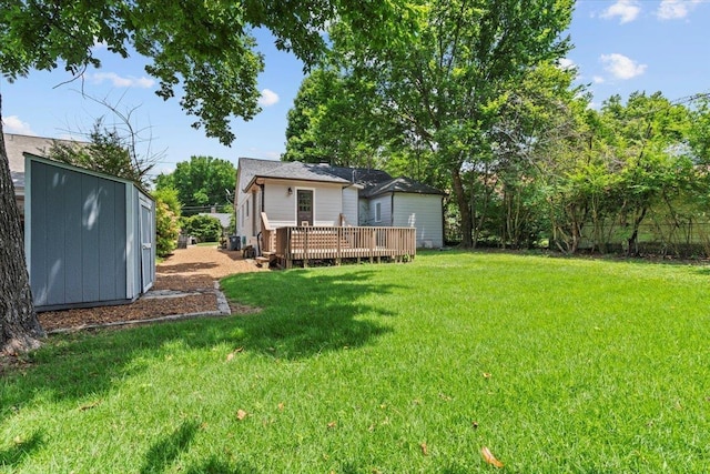 193 Alexander St, Memphis, TN 38111 - view of grassy yard with a wooden deck and a shed