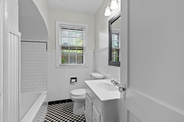 193 Alexander St, Memphis, TN 38111 - bathroom featuring a wainscoted wall, vanity, tile patterned floors, and shower / bathtub combination