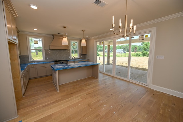 1710 Slocum Rd, Hernando, MS 38632 - kitchen with premium range hood, light wood-type flooring, tasteful backsplash, recessed lighting, and ornamental molding