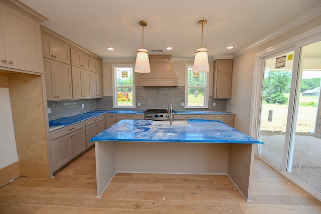 1710 Slocum Rd, Hernando, MS 38632 - kitchen featuring premium range hood, ornamental molding, backsplash, light wood finished floors, and recessed lighting