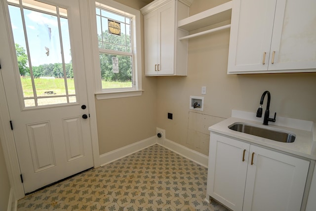 1710 Slocum Rd, Hernando, MS 38632 - washroom featuring hookup for an electric dryer, cabinet space, hookup for a washing machine, and light floors