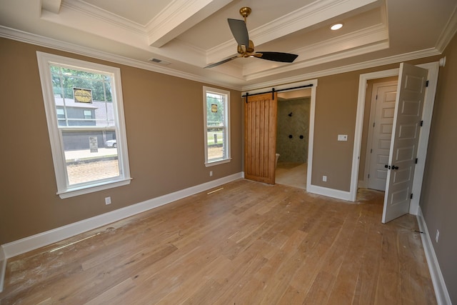 1710 Slocum Rd, Hernando, MS 38632 - unfurnished bedroom with crown molding, light wood-style flooring, a barn door, a ceiling fan, and ensuite bathroom
