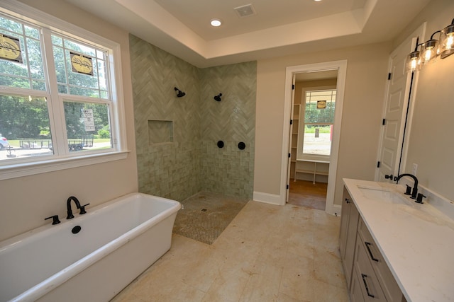 1710 Slocum Rd, Hernando, MS 38632 - full bathroom featuring a freestanding tub, a walk in shower, vanity, a tray ceiling, and recessed lighting