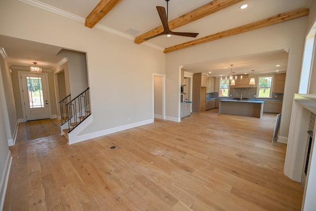 1710 Slocum Rd, Hernando, MS 38632 - unfurnished living room with light wood-type flooring, stairway, recessed lighting, beamed ceiling, and ornamental molding