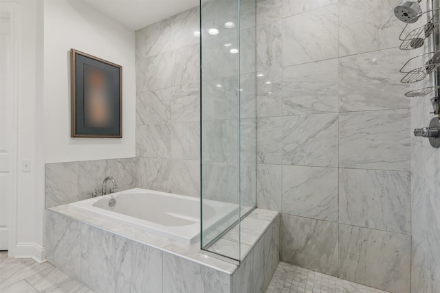 717 Riverside Dr Unit 1403, Memphis, TN 38103 - full bathroom featuring a garden tub and tiled shower
