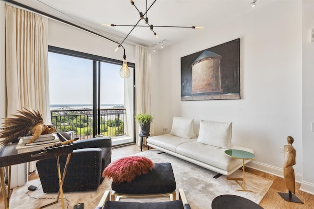 717 Riverside Dr Unit 1403, Memphis, TN 38103 - living area with wood finished floors and a chandelier