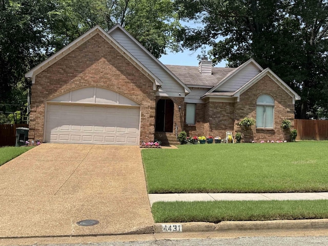 4431 Green Creek Dr, Memphis, TN 38125 - view of front of property with brick siding, an attached garage, concrete driveway, and a chimney