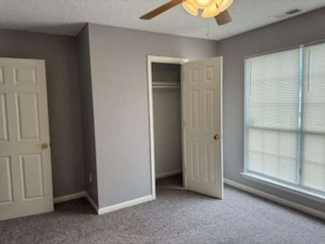 4429 S Cedar Bark Cv, Memphis, TN 38128 - unfurnished bedroom with multiple windows, carpet floors, and a closet