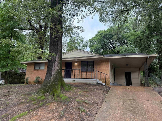 3413 Mountain Ter, Memphis, TN 38127 - ranch-style house featuring concrete driveway, a carport, brick siding, a porch, and crawl space