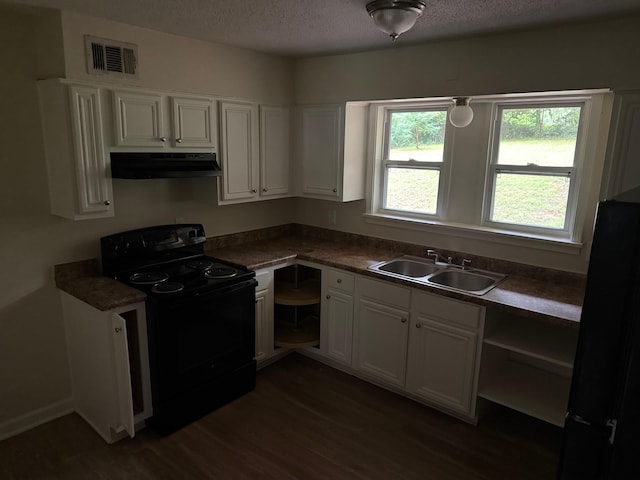 3413 Mountain Ter, Memphis, TN 38127 - kitchen with black appliances, under cabinet range hood, dark wood finished floors, white cabinets, and a textured ceiling