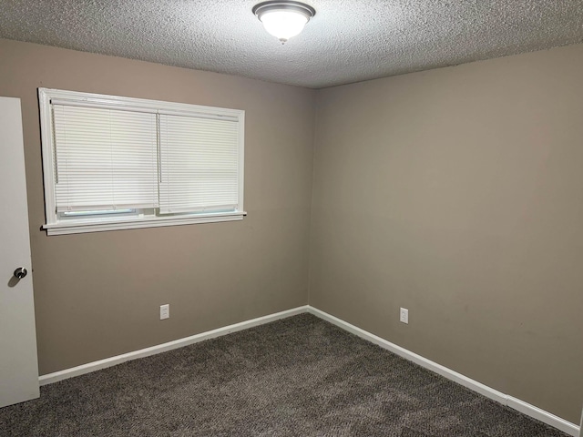 3413 Mountain Ter, Memphis, TN 38127 - unfurnished room with dark carpet and a textured ceiling