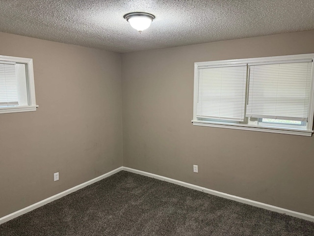 3413 Mountain Ter, Memphis, TN 38127 - spare room with dark colored carpet and a textured ceiling