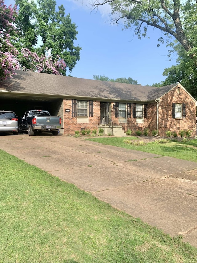 2526 Currywood Cv, Germantown, TN 38138 - single story home with concrete driveway, brick siding, a carport, and a front yard