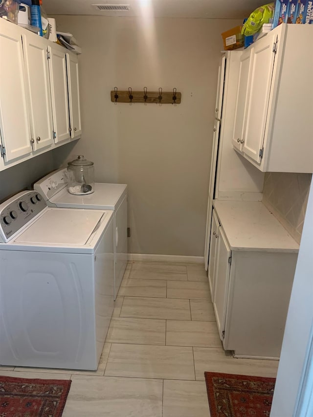 2526 Currywood Cv, Germantown, TN 38138 - laundry room with cabinet space and separate washer and dryer