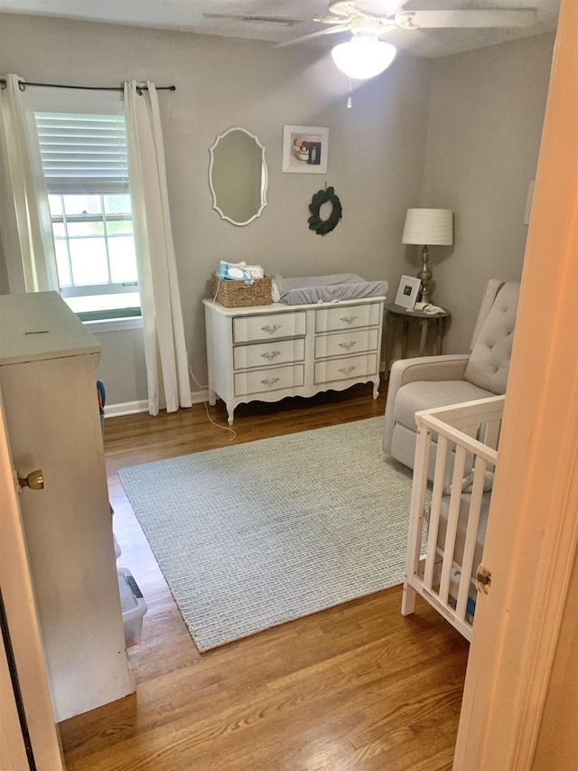 2526 Currywood Cv, Germantown, TN 38138 - bedroom with a nursery area, wood finished floors, and a ceiling fan