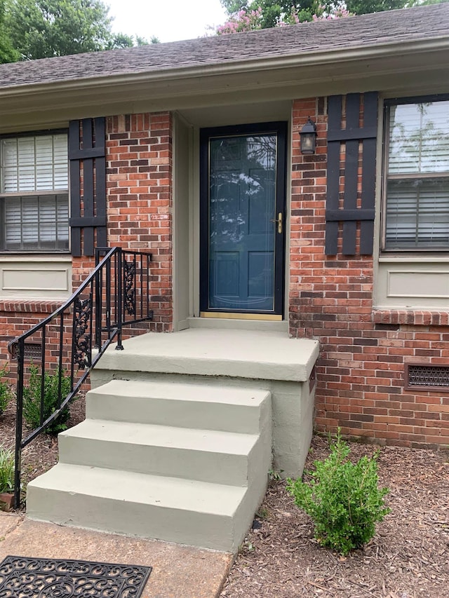 2526 Currywood Cv, Germantown, TN 38138 - doorway to property featuring brick siding and roof with shingles