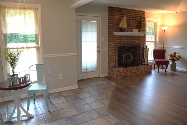 227 Lake Shore Dr, Munford, TN 38058 - living area featuring a brick fireplace and wood finished floors