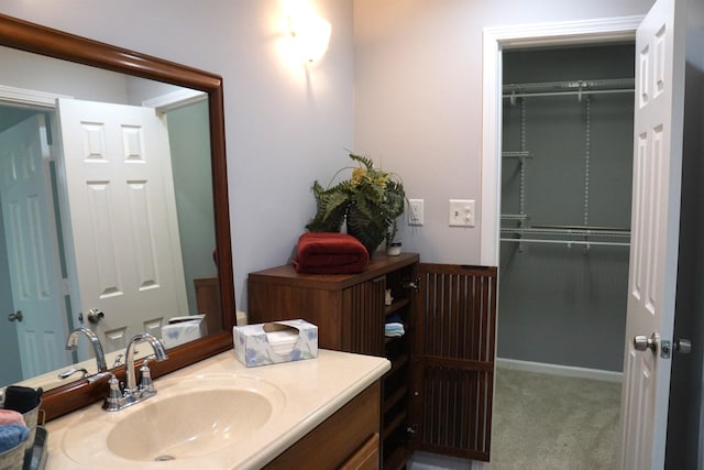 227 Lake Shore Dr, Munford, TN 38058 - bathroom featuring vanity and a spacious closet