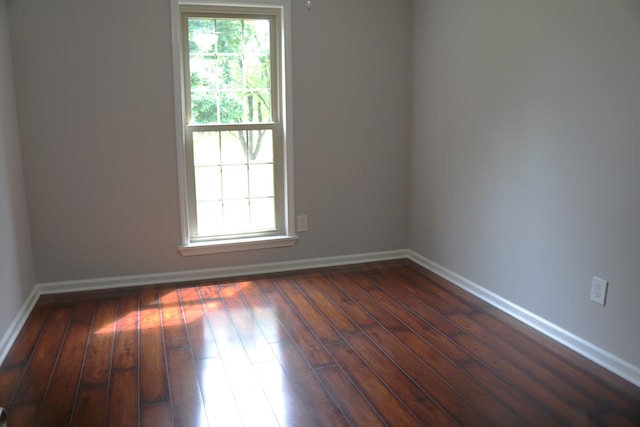 227 Lake Shore Dr, Munford, TN 38058 - unfurnished room with baseboards and dark wood-style flooring