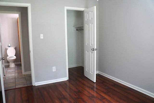 227 Lake Shore Dr, Munford, TN 38058 - unfurnished bedroom with a closet and dark wood-style floors