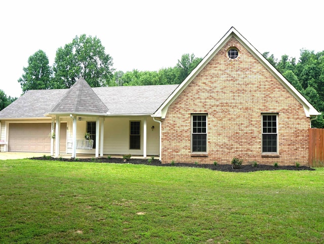 227 Lake Shore Dr, Munford, TN 38058 - view of front of property with an attached garage, covered porch, brick siding, and roof with shingles