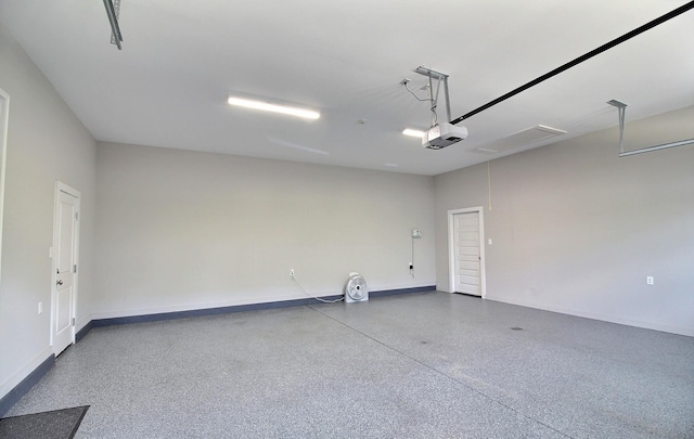3181 Chapel Woods Cv, Germantown, TN 38139 - garage featuring a garage door opener and baseboards