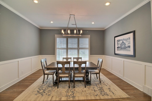 3181 Chapel Woods Cv, Germantown, TN 38139 - dining room featuring a chandelier, dark wood-style floors, crown molding, a wainscoted wall, and recessed lighting