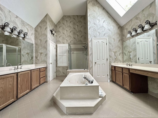 9168 Sycamore Creek Cv, Germantown, TN 38139 - full bath featuring vaulted ceiling, a skylight, a stall shower, tile patterned flooring, and a jetted tub