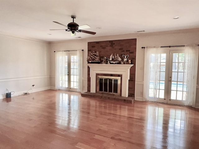 9168 Sycamore Creek Cv, Germantown, TN 38139 - unfurnished living room with french doors, healthy amount of natural light, wood finished floors, and a ceiling fan