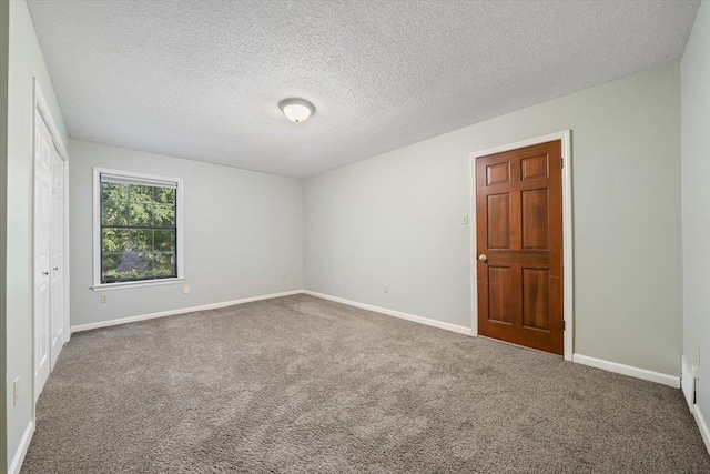 1425 Treehaven Cv, Memphis, TN 38016 - spare room featuring carpet flooring and a textured ceiling