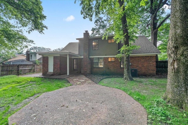 1425 Treehaven Cv, Memphis, TN 38016 - back of property featuring brick siding and a chimney