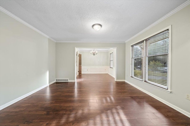 1425 Treehaven Cv, Memphis, TN 38016 - unfurnished room featuring a chandelier, dark wood finished floors, a textured ceiling, and ornamental molding